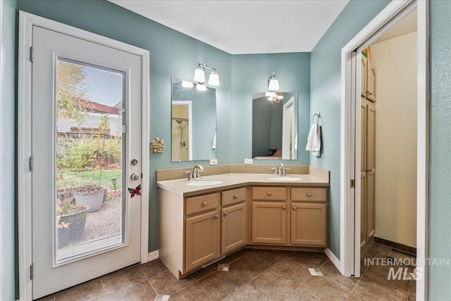 bathroom featuring tile patterned flooring and vanity