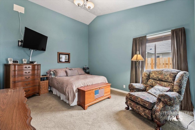 bedroom with carpet flooring and lofted ceiling