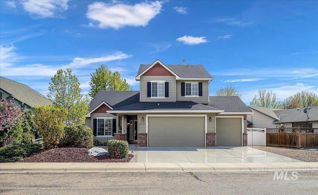 8613 W Thunder Mountain Dr, Boise, ID 83709 - craftsman-style home with fence, roof with shingles, concrete driveway, and an attached garage