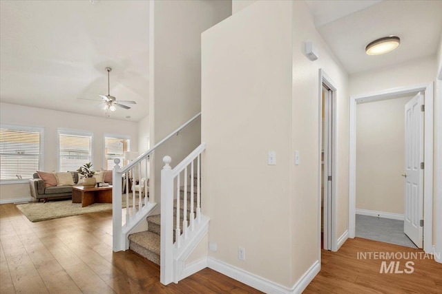 8613 W Thunder Mountain Dr, Boise, ID 83709 - stairs featuring baseboards, wood finished floors, and ceiling fan