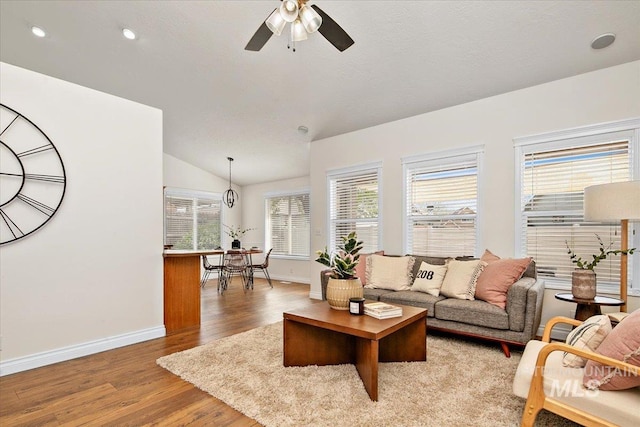 8613 W Thunder Mountain Dr, Boise, ID 83709 - living room with recessed lighting, light wood-style flooring, baseboards, a ceiling fan, and lofted ceiling