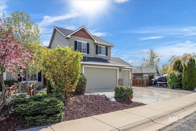 8613 W Thunder Mountain Dr, Boise, ID 83709 - traditional home with fence, driveway, and an attached garage