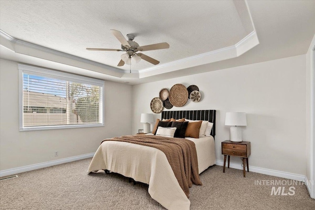 8613 W Thunder Mountain Dr, Boise, ID 83709 - bedroom with light colored carpet, baseboards, visible vents, a raised ceiling, and crown molding