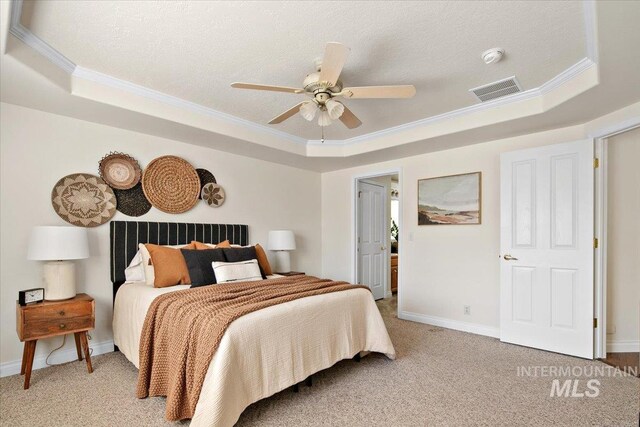 8613 W Thunder Mountain Dr, Boise, ID 83709 - bedroom featuring a raised ceiling, crown molding, visible vents, light carpet, and baseboards