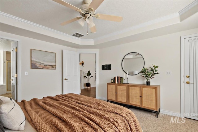 8613 W Thunder Mountain Dr, Boise, ID 83709 - bedroom with visible vents, light colored carpet, crown molding, and a tray ceiling