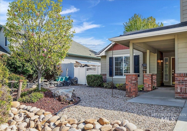 8613 W Thunder Mountain Dr, Boise, ID 83709 - view of property exterior featuring fence and brick siding
