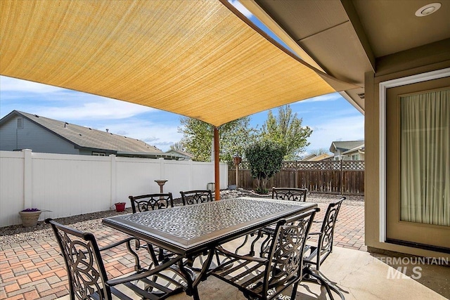 8613 W Thunder Mountain Dr, Boise, ID 83709 - view of patio / terrace with a fenced backyard and outdoor dining area