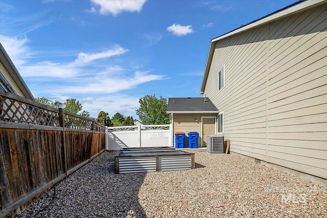8613 W Thunder Mountain Dr, Boise, ID 83709 - view of yard featuring cooling unit and a fenced backyard