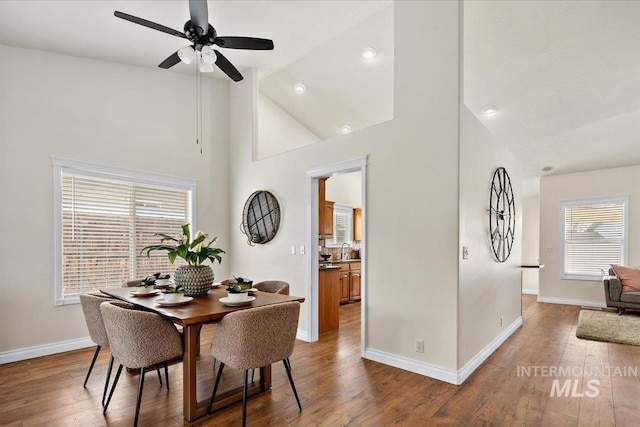 8613 W Thunder Mountain Dr, Boise, ID 83709 - dining space featuring wood finished floors, a ceiling fan, high vaulted ceiling, and baseboards