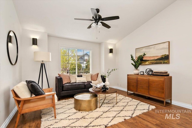 8613 W Thunder Mountain Dr, Boise, ID 83709 - living area featuring wood finished floors, ceiling fan, vaulted ceiling, and baseboards