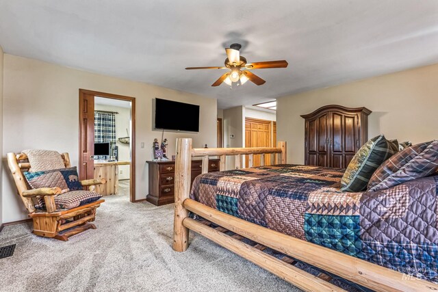 14060 Deerfield, Mccall, ID 83638 - bedroom featuring light carpet, ensuite bath, and ceiling fan