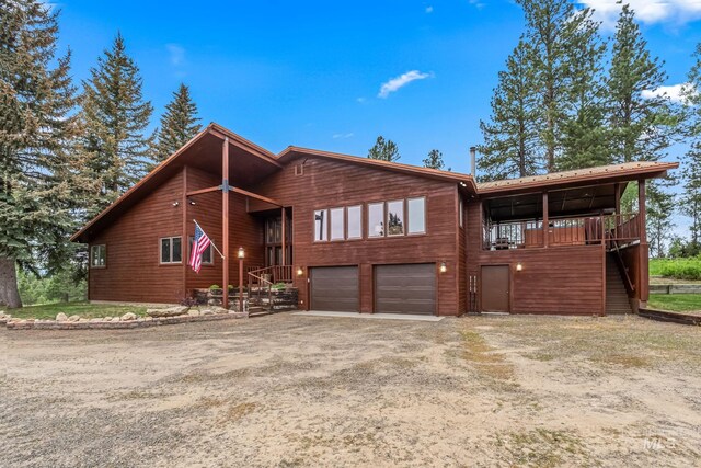 14060 Deerfield, Mccall, ID 83638 - chalet / cabin with a garage and dirt driveway