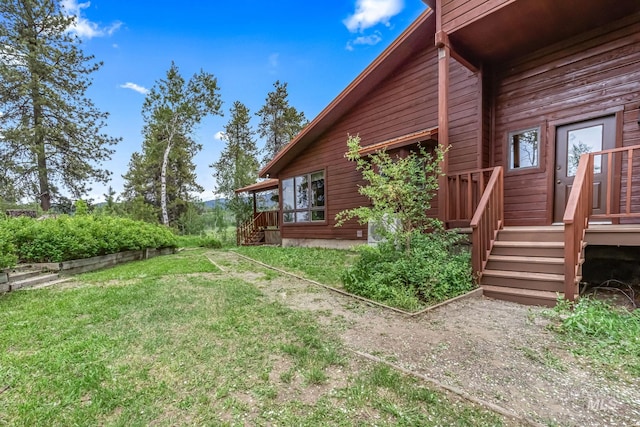 14060 Deerfield, Mccall, ID 83638 - view of side of property with a deck and a lawn