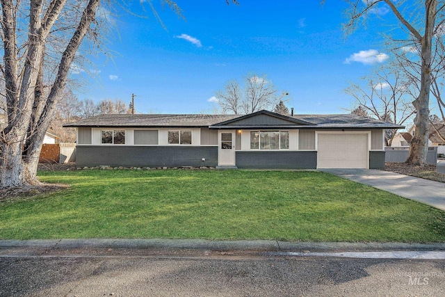 single story home featuring a garage and a front lawn