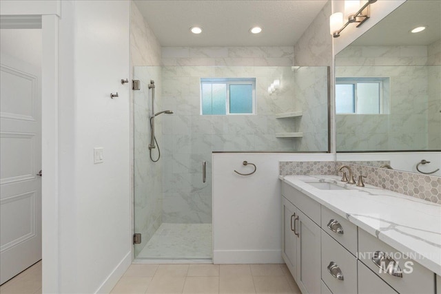 bathroom with tile patterned flooring, an enclosed shower, and vanity