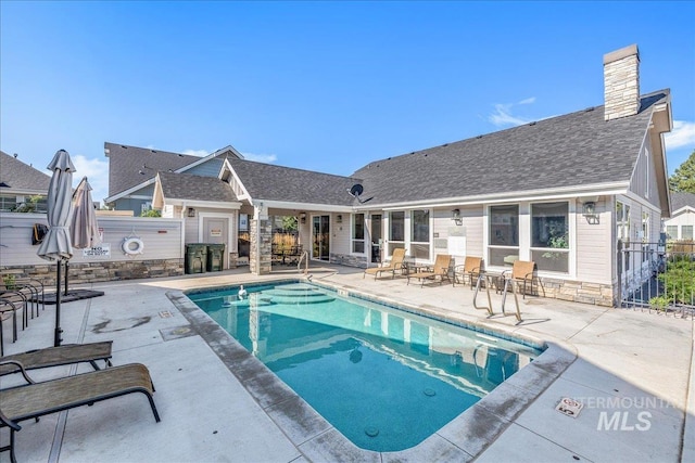 view of swimming pool with a patio area