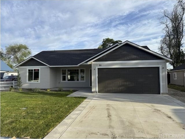 911 Franklin Rd, Marsing, ID 83639 - single story home with an attached garage, driveway, and a front yard