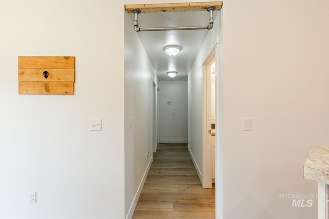 hall with light wood-type flooring