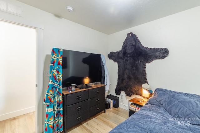 bedroom with light hardwood / wood-style flooring