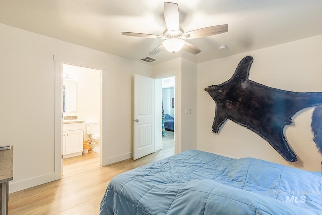 bedroom with ceiling fan, ensuite bathroom, and light hardwood / wood-style floors