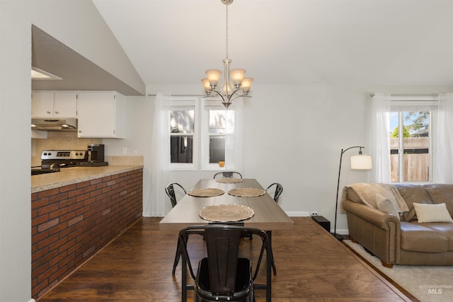 6835 W Freemont St, Boise, ID 83704 - dining room featuring wood finished floors, a chandelier, and lofted ceiling