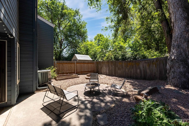 6835 W Freemont St, Boise, ID 83704 - fenced backyard featuring an outdoor fire pit and a patio area