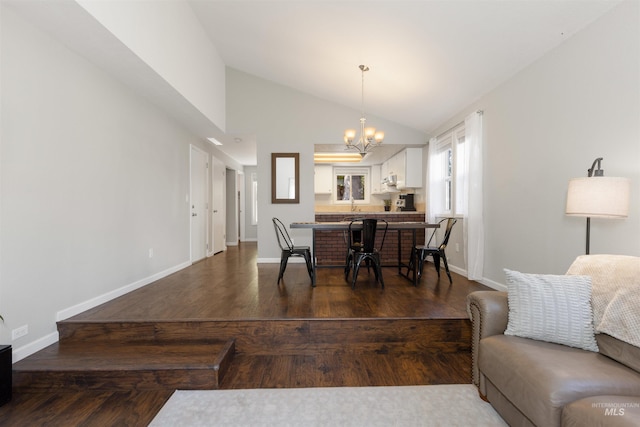 6835 W Freemont St, Boise, ID 83704 - dining space with a chandelier, lofted ceiling, and dark wood-style flooring