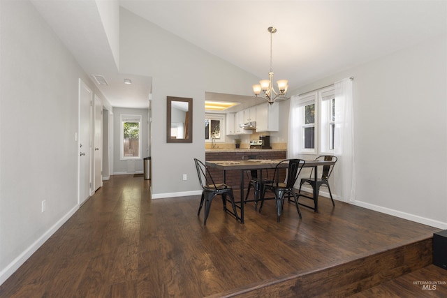 6835 W Freemont St, Boise, ID 83704 - dining space featuring a chandelier, lofted ceiling, plenty of natural light, and dark wood-style floors