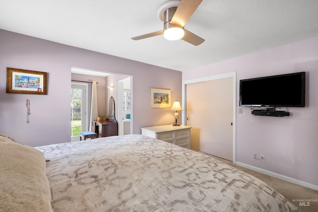 carpeted bedroom featuring baseboards and ceiling fan