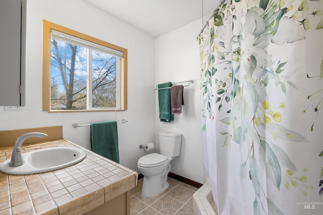 full bath featuring baseboards, toilet, vanity, a shower with curtain, and tile patterned flooring