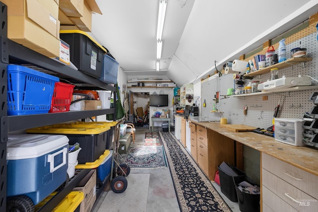 interior space with concrete flooring and open shelves