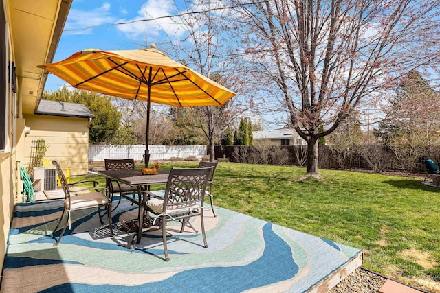 view of patio / terrace featuring central AC, outdoor dining area, and a fenced backyard