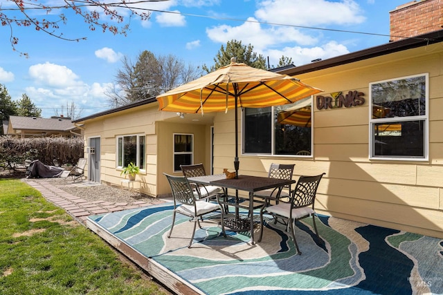 view of patio featuring outdoor dining area