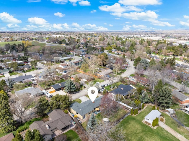 birds eye view of property with a residential view