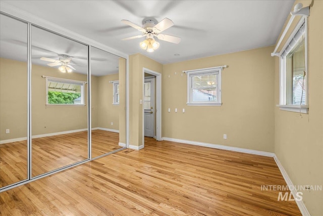 3205 W Crescent Rim Dr, Boise, ID 83706 - unfurnished bedroom featuring light wood-style floors, a closet, baseboards, and ceiling fan