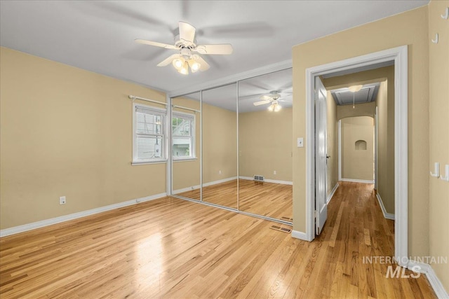 3205 W Crescent Rim Dr, Boise, ID 83706 - unfurnished bedroom featuring attic access, light wood-style flooring, baseboards, and a closet