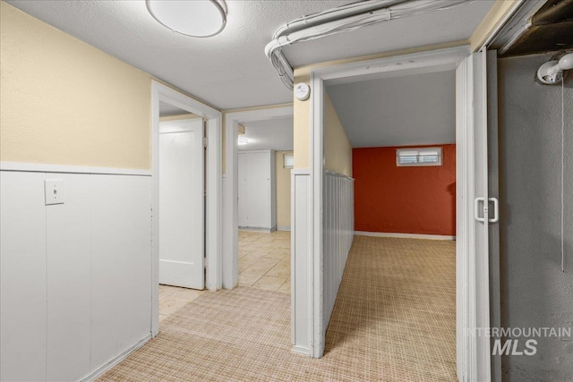 3205 W Crescent Rim Dr, Boise, ID 83706 - hallway with light colored carpet and light tile patterned floors