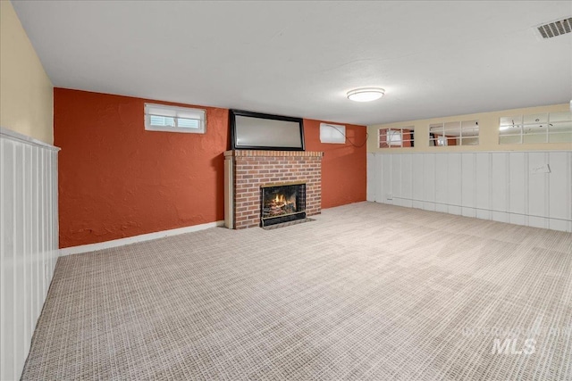 3205 W Crescent Rim Dr, Boise, ID 83706 - basement featuring carpet floors, a brick fireplace, and a textured wall
