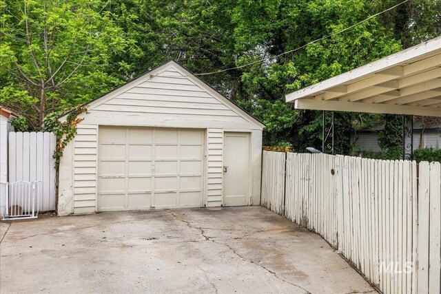 3205 W Crescent Rim Dr, Boise, ID 83706 - detached garage with driveway and fence
