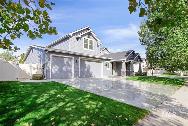 craftsman-style house featuring a front yard and a garage