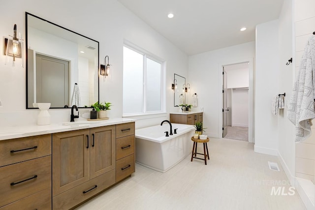 bathroom featuring a bathtub and vanity