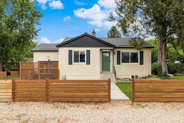 3717 W Palouse St, Boise, ID 83705 - bungalow featuring stucco siding, a shingled roof, and a chimney
