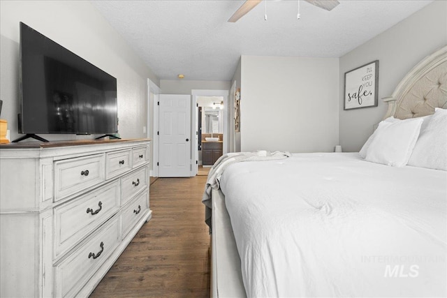 535 Seasons Ct, Nampa, ID 83686 - bedroom with wood finished floors, a textured ceiling, and ensuite bathroom