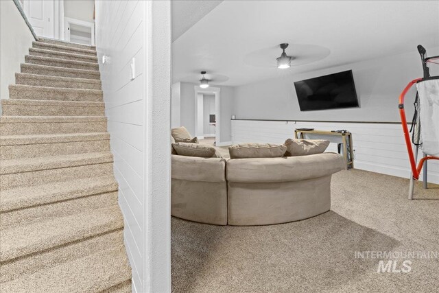 535 Seasons Ct, Nampa, ID 83686 - living area featuring ceiling fan, carpet floors, and stairs