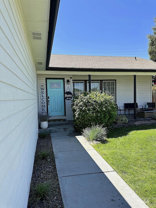 535 Seasons Ct, Nampa, ID 83686 - entrance to property with a yard and covered porch