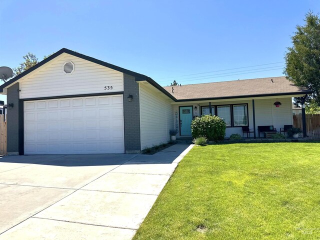 535 Seasons Ct, Nampa, ID 83686 - single story home with a front lawn, driveway, a garage, and brick siding