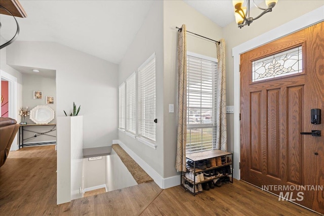 535 Seasons Ct, Nampa, ID 83686 - foyer entrance with wood finished floors, plenty of natural light, vaulted ceiling, and a chandelier