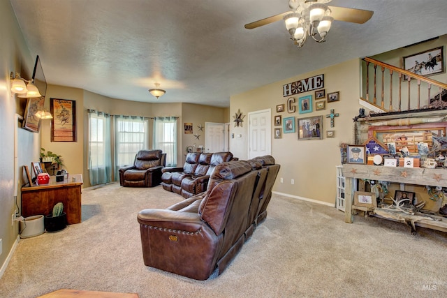 28284 Tudie Ln, Parma, ID 83660 - carpeted living room featuring a textured ceiling, a ceiling fan, and baseboards
