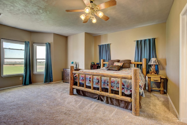 28284 Tudie Ln, Parma, ID 83660 - bedroom featuring baseboards, carpet floors, a textured ceiling, and ceiling fan