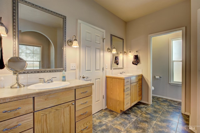 28284 Tudie Ln, Parma, ID 83660 - full bath featuring two vanities, a sink, and toilet